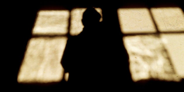 Shadow of a person in front of window