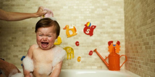 toddler crying in bathtub