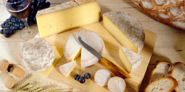 Cheeses on cutting board