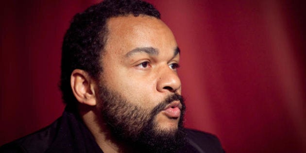 French controversial humorist Dieudonne speaks during a press conference ahead of his show on March 25, 2009 in Brussels, Belgium. Members of the Jewish community held demonstrations in front of the theater in central Brussels against his show. In the 90's, Dieudonne Mbala Mbala had a Jewish partner, and together they pushed the boundaries of stand-up, tackling subjects such as racism and stereotyping. More recently DieudonnÃ©'s routines have taken on an anti-Semitic tone. The comic, who is multi-racial, has allied himself with the French far right National Front party of Jean-Marie Le Pen. AFP PHOTO / BELGA PHOTO / DIDIER JOURET ***belgium out*** (Photo credit should read Didier Jouret/AFP/Getty Images)