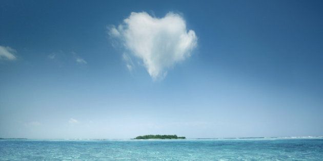 Heart shaped cloud over tropical waters