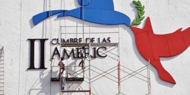 Workers give the last details in the Atlapa Convention center for the upcoming VII Summit of the Americas to take place next April 10 and 11, in Panama City, on April 6, 2015. AFP PHOTO/ Rodrigo ARANGUA (Photo credit should read RODRIGO ARANGUA/AFP/Getty Images)