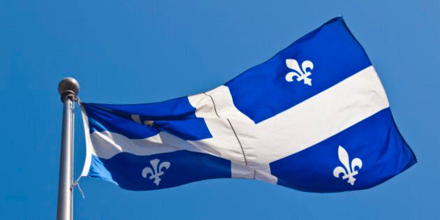 Large flag of Quebec fluttering in the wind