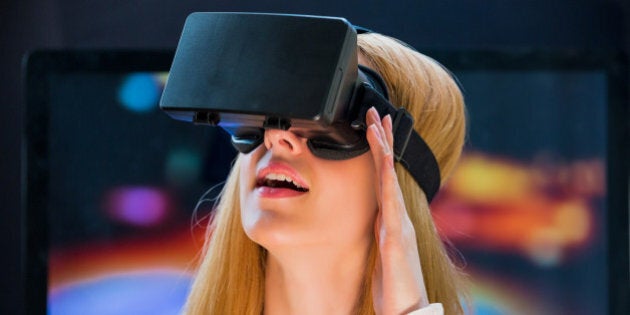 Girl with pleasure uses head-mounted display