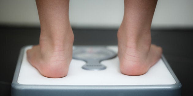 Image denotes weight, health, obesity, eating disorders, obsession.