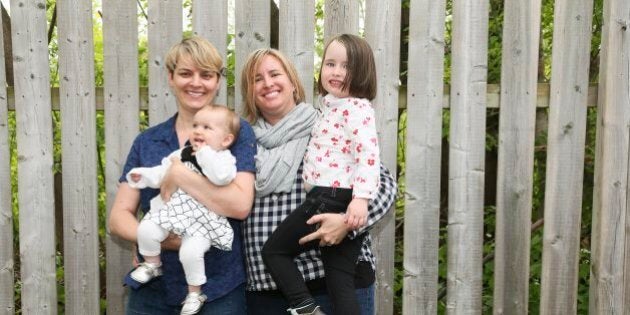 TORONTO, ON - MAY 14 - Raquel Grand (L) and Deanna Djos, mothers of Thora, 4, and Aloe, 9 months,, pose at their home, May 14, 2016. The family is part of a court case for their right both be registered as parents on their daughters birth registrations. (Andrew Francis Wallace/Toronto Star via Getty Images)