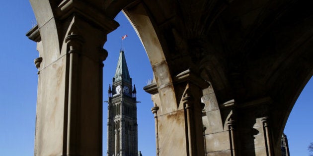 The Centre Block and Peace Tower of Parliament stand on Parliament Hill in Ottawa, Ontario, Canada, on Tuesday, Oct. 29, 2013. Stephen Poloz, governor of the Bank of Canada, said the central bank is modifying the format of its quarterly monetary policy reports to explicitly capture uncertainty in its outlook. Photographer: Patrick Doyle/Bloomberg via Getty Images