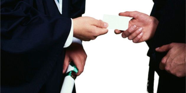 Graduates exchanging business card