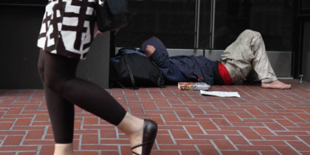 SAN FRANCISCO - SEPTEMBER 16: A homeless man sleeps in the doorway of a closed store on September 16, 2010 in San Francisco, California. The U.S. poverty rate increased to a 14.3 percent in 2009, the highest level since 1994. (Photo by Justin Sullivan/Getty Images)