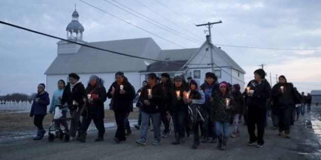 People take part in a march and candlelight vigil in the Attawapiskat First Nation in northern Ontario, Canada, April 15, 2016. REUTERS/Chris Wattie