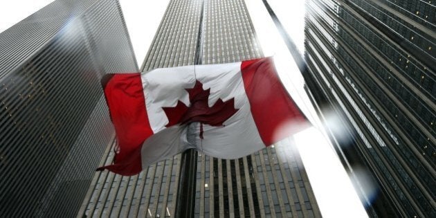 The Canadian flag flies at half-mast at the Consulate General of Canada in New York October 23, 2014. Canada's Prime Minister Stephen Harper vowed the country would 'not be intimidated' after a reported Muslim convert stormed parliament and killed a soldier on October 22 in Ottawa. AFP PHOTO / Timothy A. Clary (Photo credit should read TIMOTHY A. CLARY/AFP/Getty Images)