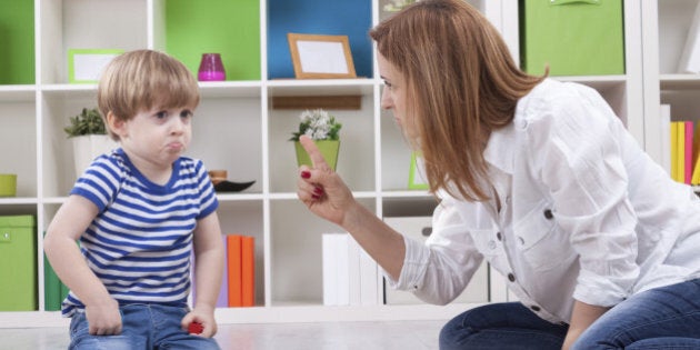 Angry mother scolding a disobedient child