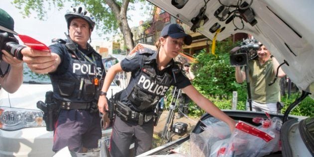 TORONTO, ON - MAY 26 - Police remove Marijuana products from Cannawide dispensary in Kensington Market on May 26, 2016. (Carlos Osorio/Toronto Star via Getty Images)