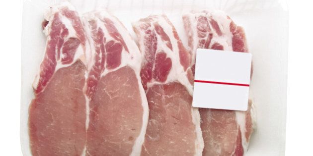 Pork chops packaged in a container with a price tag
