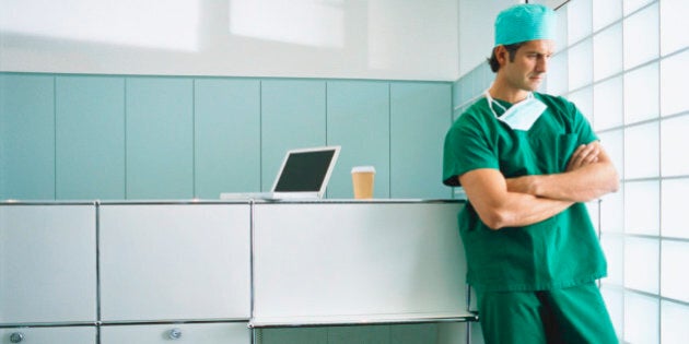 View of a young male surgeon thinking in office setting