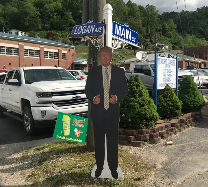 A cardboard cutout of President Donald Trump stands at a corner near Warren's event in Kermit on Friday. A small group of Trump supporters stood nearby, cheering as passing cars honked in support.