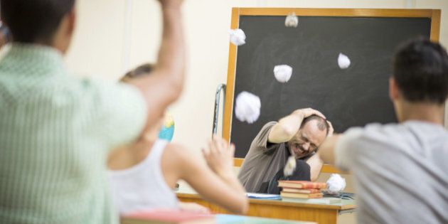 School education scene: students throwing papers at teacher