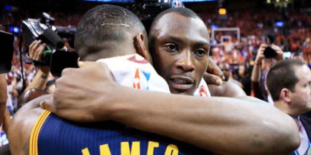 TORONTO, ON - MAY 27: LeBron James #23 of the Cleveland Cavaliers embraces Bismack Biyombo #8 of the Toronto Raptors after the Cleveland Cavaliers defeated the Toronto Raptors 113 to 87 in game six of the Eastern Conference Finals during the 2016 NBA Playoffs at Air Canada Centre on May 27, 2016 in Toronto, Canada. NOTE TO USER: User expressly acknowledges and agrees that, by downloading and or using this photograph, User is consenting to the terms and conditions of the Getty Images License Agreement. (Photo by Vaughn Ridley/Getty Images)