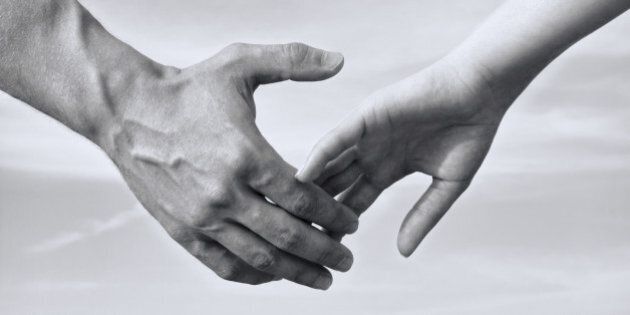 Man and woman holding hands, black and white photo