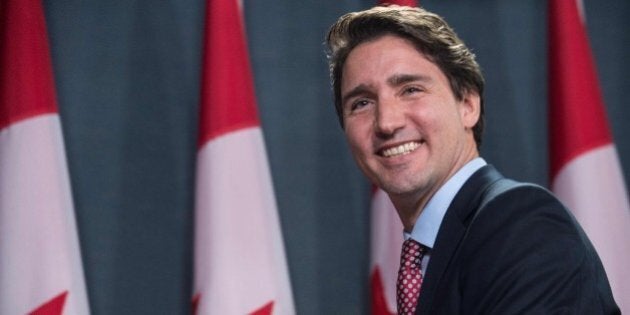 Canadian Liberal Party leader Justin Trudeau smiles at the end of a press conference in Ottawa on October 20, 2015 after winning the general elections. Liberal leader Justin Trudeau reached out to Canada's traditional allies after winning a landslide election mandate to change tack on global warming and return to the multilateralism sometimes shunned by his predecessor. AFP PHOTO/NICHOLAS KAMM (Photo credit should read NICHOLAS KAMM/AFP/Getty Images)