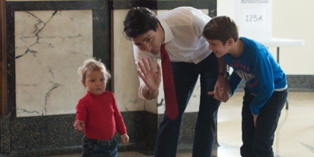 Canadian Liberal Party leader Justin Trudeau waits with his sons Hadrien (L) and Xavier to cast his ballot in Montreal on October 19, 2015. The first of 65,000 polling stations opened Monday on Canada's Atlantic seaboard for legislative elections that pitted Prime Minister Stephen's Tories against liberal and social democratic parties. Up to 26.4 million electors are expected to vote in 338 electoral districts. Some 3.6 million already cast a ballot in advance voting a week ago, and the turnout Monday is expected to be high. AFP PHOTO/NICHOLAS KAMM (Photo credit should read NICHOLAS KAMM/AFP/Getty Images)