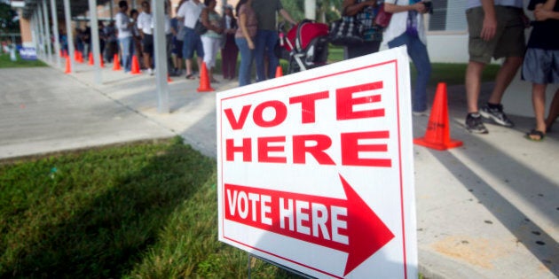 People stand in line to vote early Sunday, Oct. 28, 2012, in Pembroke Pines, Fla. On the only Sunday that Florida polls will be open for early voting this election cycle, faith leaders from 44 congregations in six Florida cities will lead their congregations to early voting locations in a massive