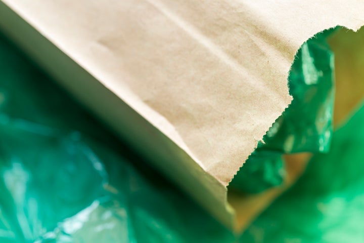 If you accept a paper or plastic bag at the grocery store, the best thing you can do is bring it home and reuse it as much as you can.