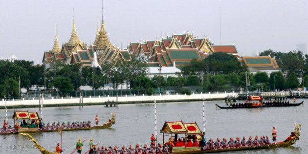 Ornate barges parade past the Grand Palace on the Chao Phraya River during rehearsal of Royal Barge Procession in Bangkok, Thailand, Friday, Nov. 2, 2012. The procession to make merit at a Thai Buddhist temple is scheduled for Nov. 9, 2012 after the Buddhist Lent has concluded. The procession was scheduled to take place last year but was delayed by the countryâs worst flooding in half a century. (AP Photo/Sakchai Lalit)