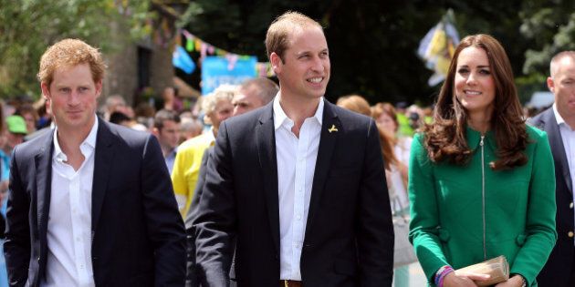 Prince William, centre, Kate Duchess of Cambridge and Prince Harry walk along the street to celebrate the start of the Tour de France in Yorkshire at West Tanfield, England, Saturday, July 5, 2014. The 198 competitors in the 101st Tour de France have started their grueling three-week ride through four countries before ending the world's greatest cycling race in Paris on July 27. (AP Photo/Scott Heppell/Pool)