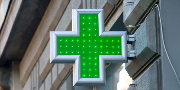 Green sign of the Red Cross as a designation for pharmacy