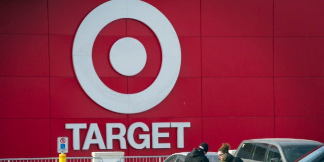 Shoppers unload a shopping cart after exiting a Target Corp. store in Toronto, Ontario, Canada, on Thursday, Jan. 15, 2015. Target Corp. will walk away from Canada less than two years after opening stores there, putting an end to a mismanaged expansion that racked up billions in losses. Photographer: Kevin Van Paassen/Bloomberg via Getty Images