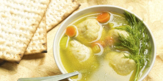 Delicious Matzoh ball soup with crackers wine and dill