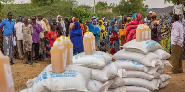 Ethiopians queue to receive aid distributed under a European Union (EU) funded project, in the Shinile Zone of Ethiopia Friday, April 8, 2016, near the border with Somalia. According to the European Commission, the EU has announced 122.5 million euros in aid to address the immediate needs of people affected by a worsening humanitarian and drought situation in Ethiopia. (AP Photo/Mulugeta Ayene)