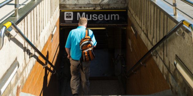 TORONTO, ONTARIO, CANADA - 2015/06/03: Toronto everyday scenes: Man walking down the stairs of the underpass leading to the Museum subway station. Museum is a subway station on the Yonge University line in Toronto. It is located under Queen's Park beside the Royal Ontario Museum. (Photo by Roberto Machado Noa/LightRocket via Getty Images)