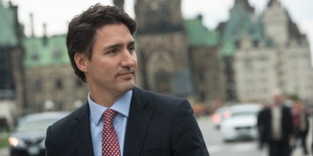 Canadian Liberal Party leader Justin Trudeau walks from the parliament to give a press conference in Ottawa on October 20, 2015 after winning the general elections. AFP PHOTO/NICHOLAS KAMM (Photo credit should read NICHOLAS KAMM/AFP/Getty Images)