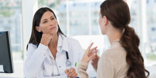 Female doctor discussing with a patient