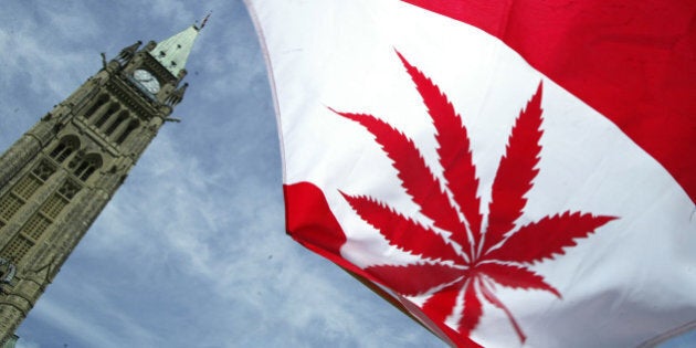 OTTAWA, ON - JUNE 5: A Canadian flag with a marijuana leaf flies during a rally in support of legalizing marijuana on June 5, 2004 alongside Parliament Hill In Ottawa, Canada. The Supreme Court of Canada recently upheld a decision to keep marijuana as a banned substance. (Photo by Donald Weber/Getty Images)