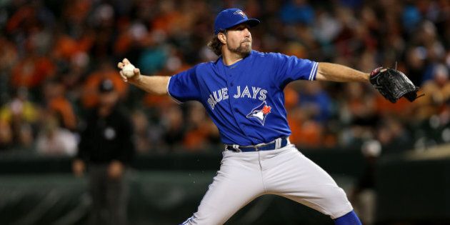 BALTIMORE, MD - SEPTEMBER 30: Starting pitcher R.A. Dickey #43 of the Toronto Blue Jays works the third inning against the Baltimore Orioles during game two of a double header at Oriole Park at Camden Yards on September 30, 2015 in Baltimore, Maryland. (Photo by Patrick Smith/Getty Images)