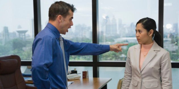 Businessman yelling at coworker