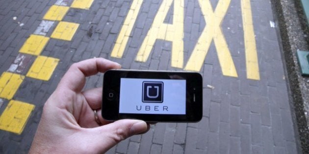 The logo of Uber car service app is seen on a smart phone during a protest by Brussels taxi drivers against the taxi-app Uber, on September 13, 2015, in Brussels. AFP PHOTO / BELGA / NICOLAS MAETERLINCK =BELGIUM OUT= (Photo credit should read NICOLAS MAETERLINCK/AFP/Getty Images)