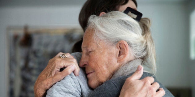 senior mother and daughter hugging