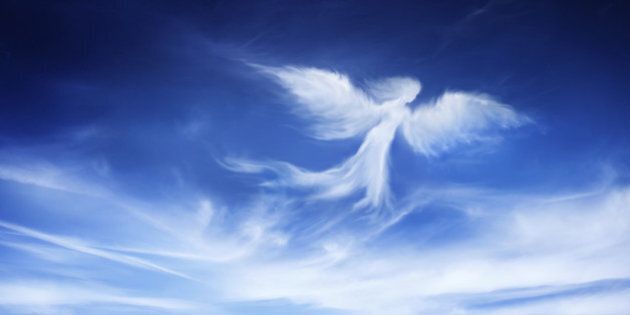 angel-shaped cloud in the sky