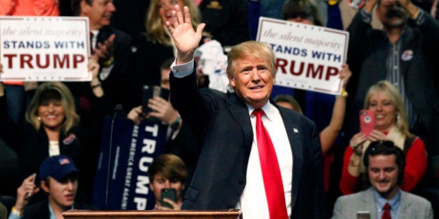 Republican presidential candidate Donald Trump waves during a rally in Biloxi, Miss., Saturday, Jan. 2, 2016. (AP Photo/Rogelio V. Solis)