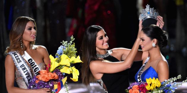 LAS VEGAS, NV - DECEMBER 20: (L-R) Miss Colombia 2015, Ariadna Gutierrez Arevalo, looks on as Miss Universe 2014 Paulina Vega crowns Miss Philippines 2015, Pia Alonzo Wurtzbach, the new Miss Universe during the 2015 Miss Universe Pageant at The Axis at Planet Hollywood Resort & Casino on December 20, 2015 in Las Vegas, Nevada. Gutierrez Arevalo was first crowned Miss Universe after host Steve Harvey mistakenly named her the winner instead of first runner-up. (Photo by Ethan Miller/Getty Images)