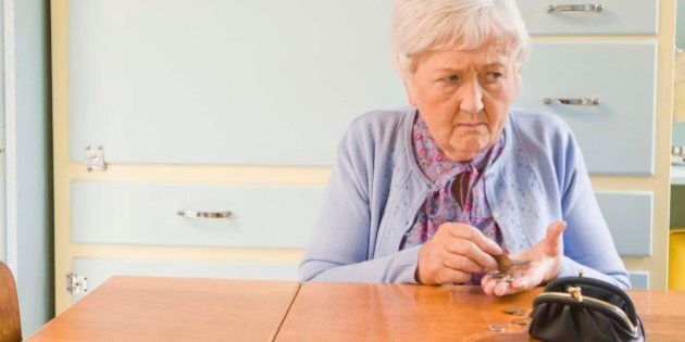Worried woman counting coins