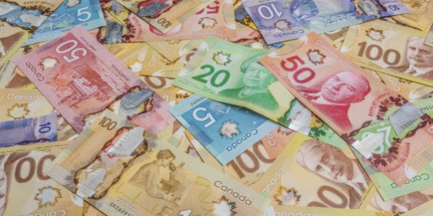 Canadian dollar bills spread out.