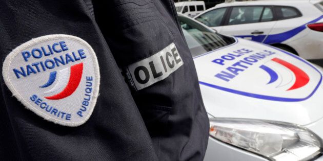 An illustration picture shows a French National Police insignia on the uniform of an officer who stands near parked cars outside the Police Headquarters in Bordeaux, France, February 8, 2016. REUTERS/Regis Duvignau