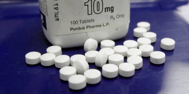 FILE - This Feb. 19, 2013, file photo, shows OxyContin pills arranged for a photo at a pharmacy in Montpelier, Vt. Prescription painkillers should not be a first-choice for treating common ailments like back pain and arthritis, according to new federal guidelines designed to reshape how doctors prescribe drugs like OxyContin and Vicodin. Amid an epidemic of addiction and abuse tied to these powerful opioids drugs, the CDC is urging general doctors to try physical therapy, exercise and over-the-counter pain medications before turning to painkillers for chronic pain. (AP Photo/Toby Talbot, File)