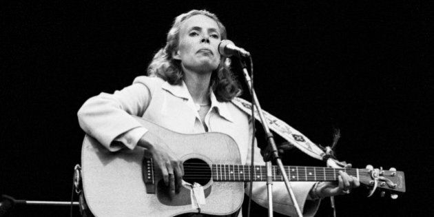 LONDON - SEPTEMBER 14: Joni Mitchell performs live on stage at Wembley Stadium, London on 14th September 1974. (Photo by Gijsbert Hanekroot/Redferns)