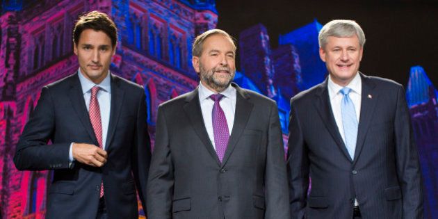 Justin Trudeau, leader of the Liberal Party of Canada, from left, Thomas 'Tom' Mulcair, leader of the New Democratic Party, and Conservative Leader Stephen Harper, Canada's prime minister, stand for a photograph prior to the second leaders' debate in Calgary, Alberta, Canada, on Thursday, Sept. 17, 2015. The debate pits Harper and his Conservative Party's program of tax cuts and spending restraint against the Liberal Party's Trudeau who is pledging to raise taxes on the highest earners and Mulcair of the New Democratic Party who advocates increasing levies on corporations. Photographer: Ben Nelms/Bloomberg via Getty Images